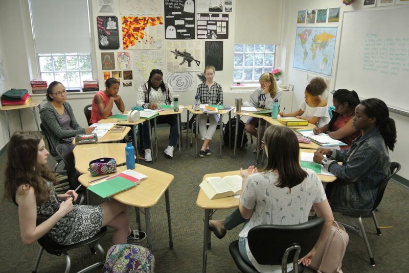 students_sitting_at_their_desks_in_a_circle.jpg